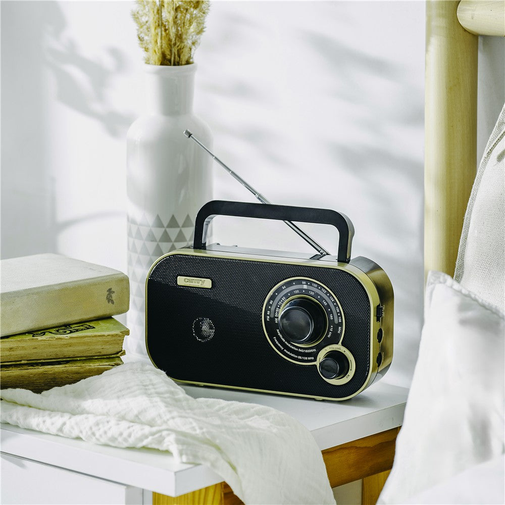 Camry CR 1910g tragbares Radio, FM/AM Kofferradio mit 2 W Lautsprecher, Netz- und Batteriebetrieb, 3,5 mm Kopfhöreranschluss, Teleskopantenne, schwarz/gold